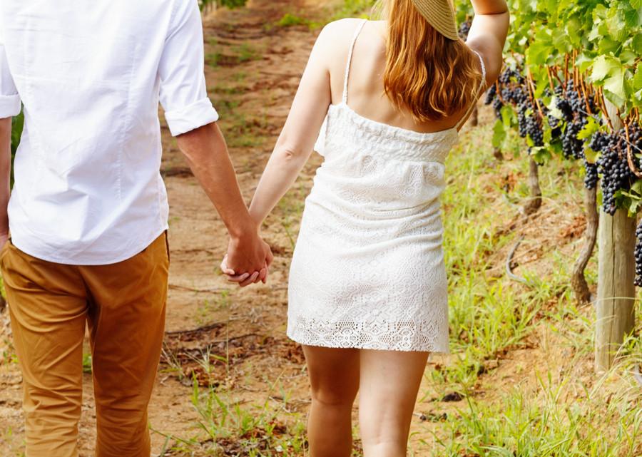 couple walking in vineyard