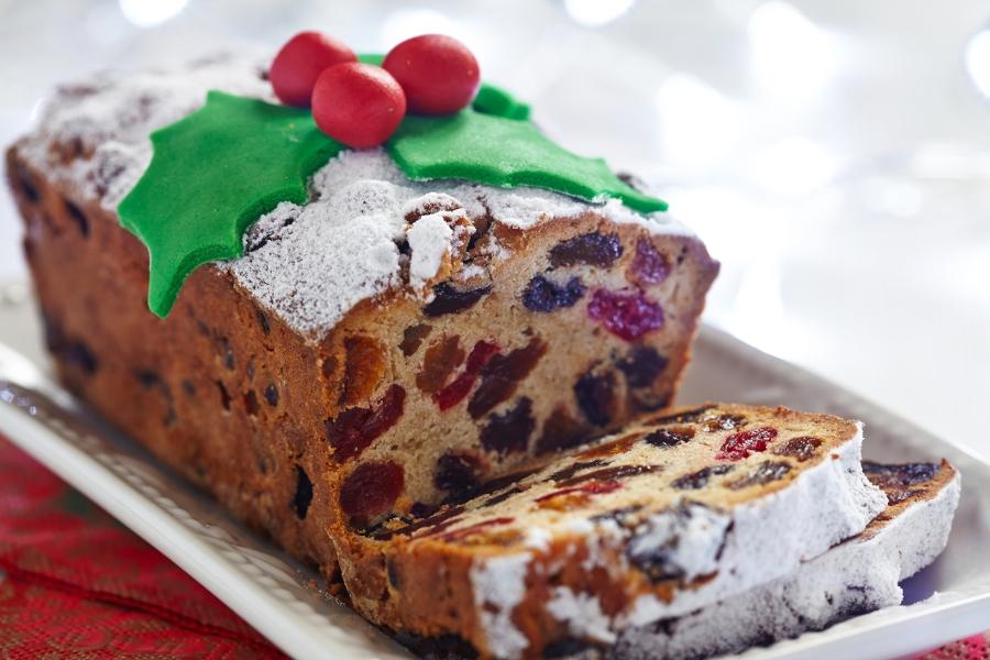 Christmas fruit cake decorated with holly and berries